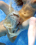 Two teenage girls having fun with their own blowup doll