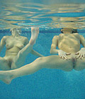  Two horny chicks are playing with blowupdolls in the pool