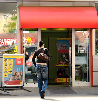 Cute chick sucking a big dick through hole in the toilet