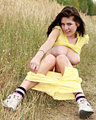 Hot cutie playing with her wet pussy naked in the grass