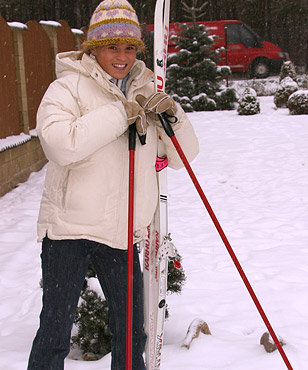 Hot teenage babe playing in the snow with a dildo outside