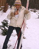 Hot teenage babe playing in the snow with a dildo outside