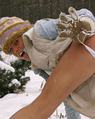 Hot teenage babe playing in the snow with a dildo outside