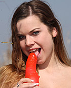 Very horny cutie fondling her pussy outside in the bushes