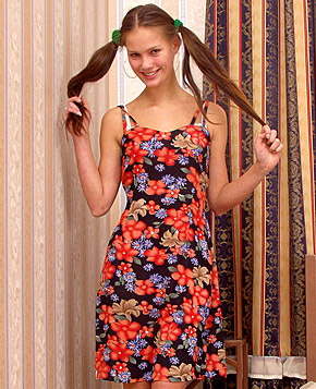 A cute horny teenager with pigtails playing with herself