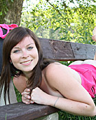 Very horny teenage girl masturbates on a bench outdoors