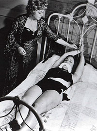 Vintage naked chicks are slapped hard and tied to a bed