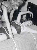 Vintage naked chicks are slapped hard and tied to a bed