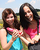 Two sexy girls love fondling eachother outdoors with a toy