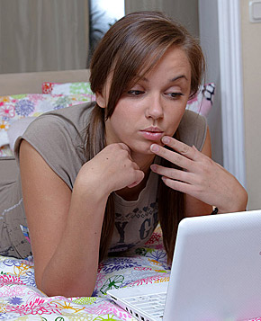 Porn watching teenage girl pleasures her very slippery clit