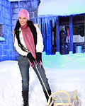 A busty teenage sweetie enjoys playing in the cold snow