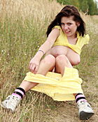 Teenage brunette fondling her moist cooch using a dildo