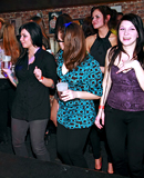 Drunk partygoers having outrageous sex inside of a publicbar