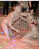 Two sexy daring girls enjoy swimming in cream at the club