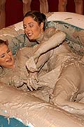 Two very hot lesbian babes duke it out in some thick mud