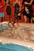 Two very hot lesbian babes duke it out in some thick mud