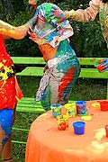 Three hot babes getting messy and naked with paint outside