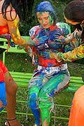 Three hot babes getting messy and naked with paint outside