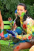Three hot babes getting messy and naked with paint outside