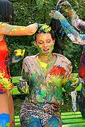 Three hot babes getting messy and naked with paint outside