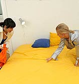 Cute brunette and a blonde in a hot fuck and pissing 3 some