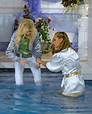 Sexy lesbians love swimming together in a big public pool