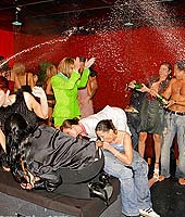 Stunning babes soaked in alcohol sucking hard cock in group