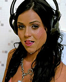 Hard rock chick sucking a rubber cock through a gloryhole