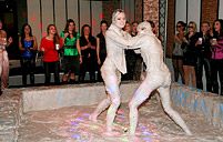 Very hot lesbian chicks wrestling in a pool of moist dirt