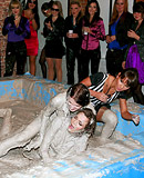 Horny and lesbian beauties love bathing in the mud pool