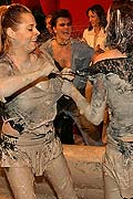Topless muddy brunette wrestling babe winning the match