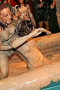 Topless muddy brunette wrestling babe winning the match