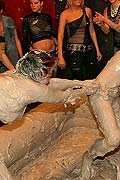 Topless muddy brunette wrestling babe winning the match