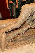 Topless muddy brunette wrestling babe winning the match