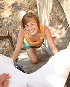 A very sexy sweetie enjoys pleasuring his knob outdoors