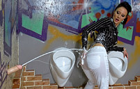 Sexy and clothed sweetheart covered in wet slippery slime