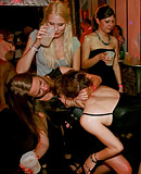 Clothed chicks playing with klarge stiff peckers at a club