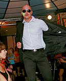 Clothed chicks playing with klarge stiff peckers at a club