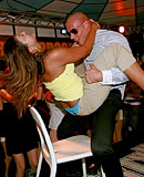 Clothed chicks playing with klarge stiff peckers at a club