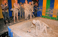 A couple of sexy horny girls playing in dirty gray slime