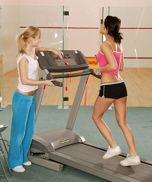 Two very cute fitness lesbians licking damp cunt at the gym