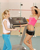 Two very cute fitness lesbians licking damp cunt at the gym