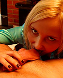 A gorgeous hottie playing with a stiff prick in her mouth