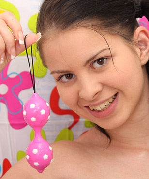 Hot naked teen chick loves masturbating with anal beads