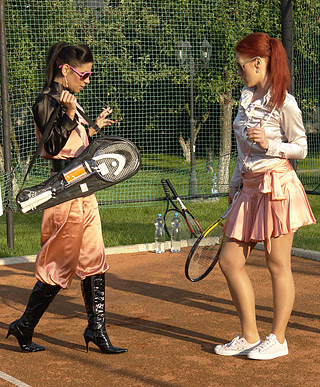 Sporty sweethearts enjoy playing with wet bottled water