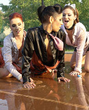 Sporty sweethearts enjoy playing with wet bottled water