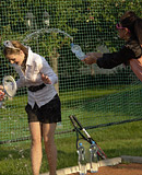 Sporty sweethearts enjoy playing with wet bottled water