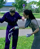 Hot fetish chicks playing with the dirty trash outdoors