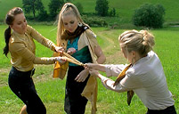 Three sweethearts fooling around with car washing water