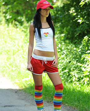 Roller skating babe plays with her soaked cooch outside